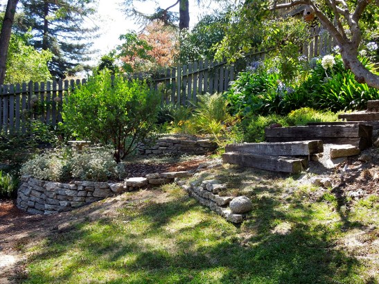 Before: The original path to the backyard was a steep and uneven mix of ramps, railroad ties, urbanite, and bare slopes.